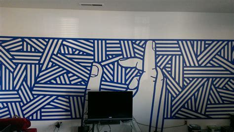 3 rolls of blue tape+6 hours +boredom = new wall mural for my apartment ...