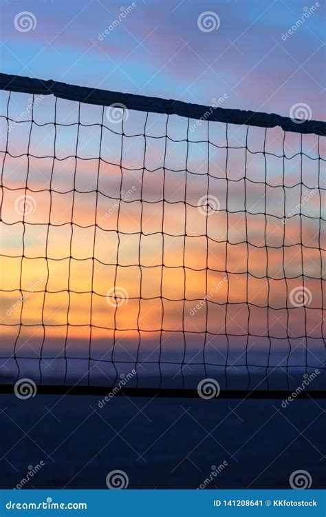 Beach Sunset through Volleyball Net Stock Image - Image of sand, sports: 141208641