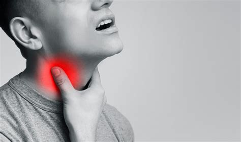 Young Man Suffering From Pain In Throat Touching Inflamed Neck Stock Photo - Download Image Now ...