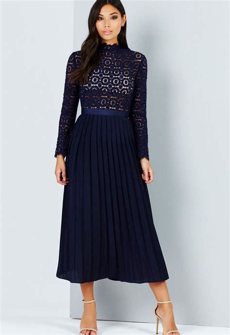 A stunning 2 in 1 midi dress with pleated skirt and long sleeve crochet top with high neck. This ...