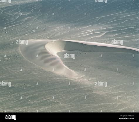 Aerial view of barchan dunes showing typical horns and downwind slip ...