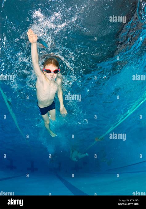 Kids swimming training Stock Photo - Alamy