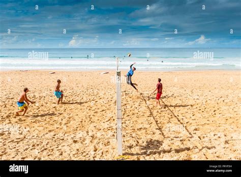 Young men play beach volleyball on a beach in Manly Sydney Australia Stock Photo - Alamy