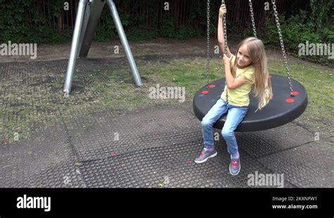 Happy Smiley Girl Swinging Outdoor, Child Playing at Playground Park ...