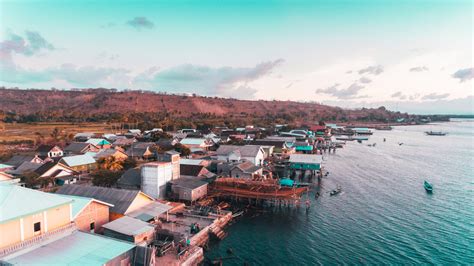 Aerial view of fisherman village in Labuan Jambu, Sumbawa, Indonesia. Traditional house with ...