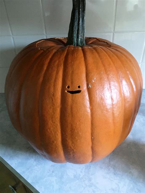 Adorable Jack-o'-Lantern With a Very Tiny Face Carved Into It