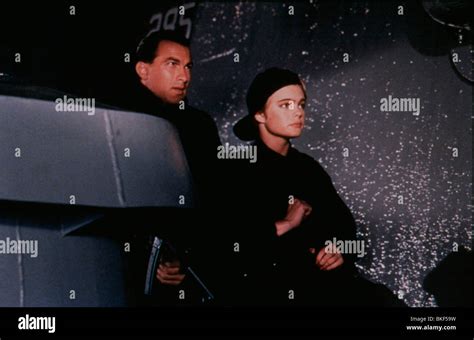 UNDER SIEGE (1992) STEVEN SEAGAL, ERIKA ELENIAK UNSG 036 Stock Photo - Alamy