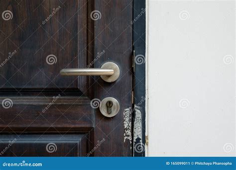 Modern Door Knob with Rusty Door Lock Underneath Stock Image - Image of ...