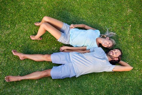 Grass Laying Couple Stock Photo - Download Image Now - iStock