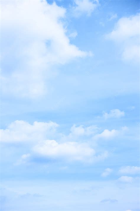 Premium Photo | Pastel blue sky with light clouds - vertical background