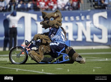 T-Rac, the Tennessee Titans' mascot, performs before an NFL football game between the Titans and ...