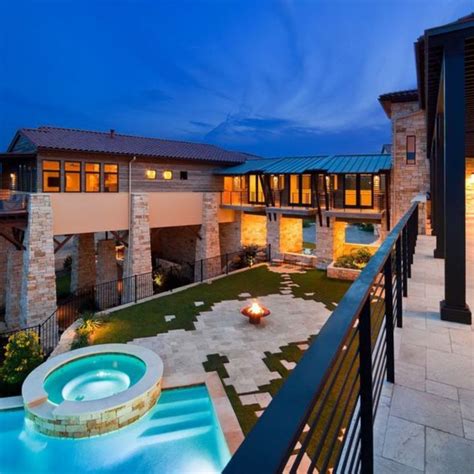 This luxurious Mediterranean home offers multiple balconies — most with breathtaking views of ...