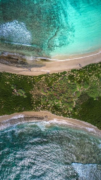 Premium Photo | Aerial view of a tropical beach with a blue clean water