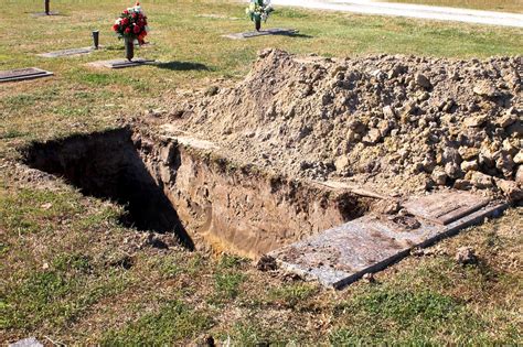 Grave digger critically hurt after falling into empty grave