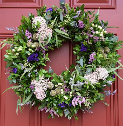 Spring wreath with fresh florals and greens - myrtle, eucalyptus, rice flowers, statice ...