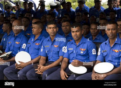 Members of the Sri Lankan Navy listen to Sri Lankan President ...