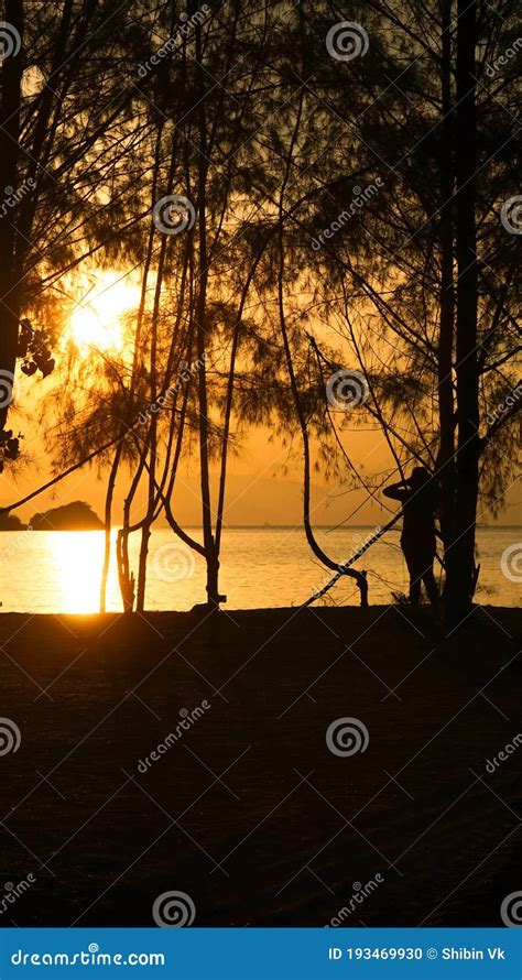 Silhouette of a Girl Enjoying the View of Sunset in the Tanjung Rhu ...