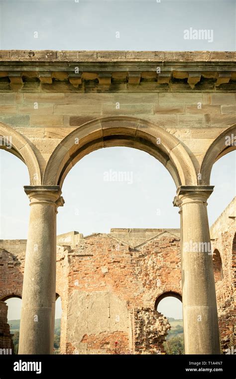 Ruins of an old building in the ancient Greek style with stone arches and Doric columns Stock ...