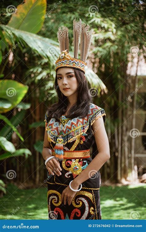 Asian Woman in Traditional Clothes of Dayak Tribe Standing with Solemn ...