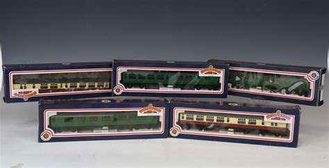 A collection of Bachmann Branch-Line gauge OO railway items, including coaches in various liveries,