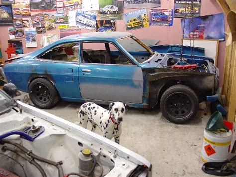 The dog shows off his project : Datsun 1200 Club