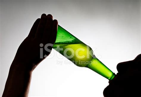 Silhouette Of Someone Drinking A Beer Stock Photo | Royalty-Free ...