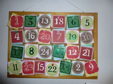 Advent Calendar! I made it using a small bulletin board and pretty Christmas numbers. Stuck ...