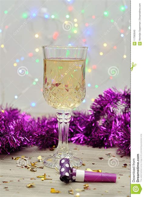 A Glass of Champagne Displayed with Purple Tinsel Stock Image - Image ...