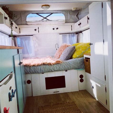 Pop-top caravan renovations - double bed tucked into one end of this bright caravan Pop Up ...