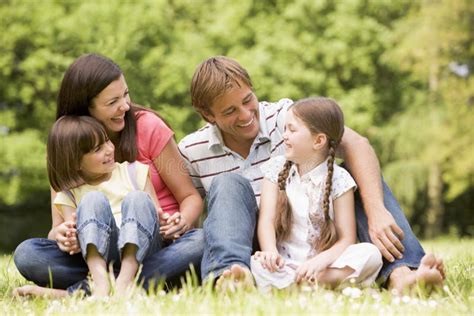 Family Outdoors in Rain with Umbrella Smiling Stock Photo - Image of children, coat: 5936418