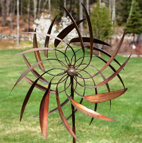 Garden Pinwheel This beautifully designed metal garden ornament features pinwheels that spin in ...