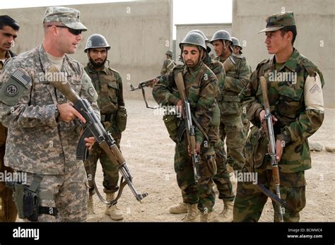 Afghan National Army recruits in training at the Kabul Military Training Center with a US Army ...