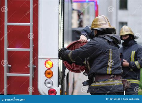 A Member of the Fire Brigade Puts the Equipment Editorial Stock Photo - Image of protection ...