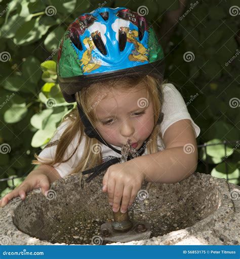 Child Drinking Water from a Fountain Stock Image - Image of fountain ...