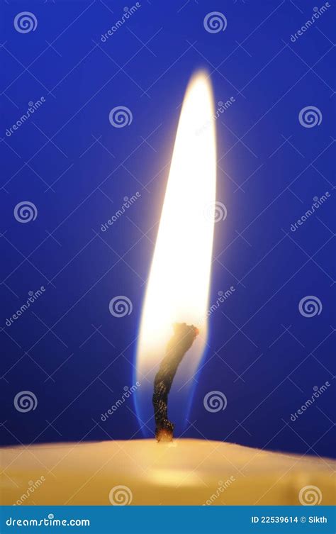 Burning Candle Flame Close-Up on Blue Background Stock Photo - Image of close, decorative: 22539614