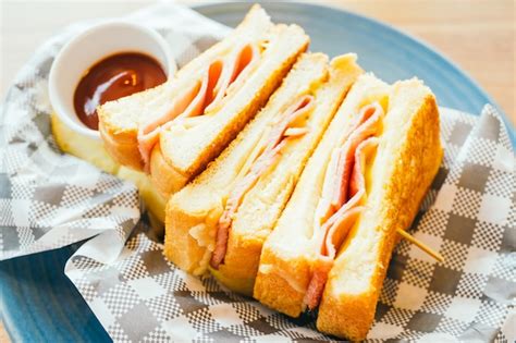 Free Photo | Sandwich with ham cheese and french fries and tomato sauce