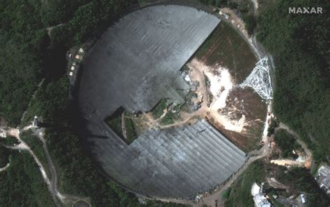 Cleanup of Arecibo Observatory's collapsed radio telescope seen from ...