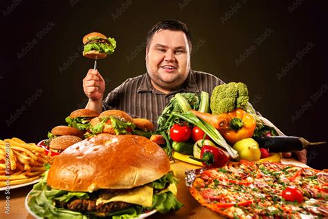 Diet fat man who makes choice between healthy and unhealthy food. Overweight male with ...