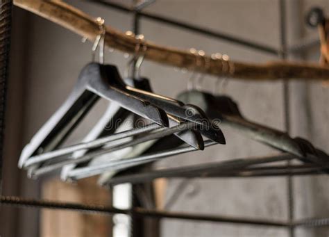 Black Clothes Hangers without Clothes Hang in the Wardrobe Stock Image - Image of factory, brown ...