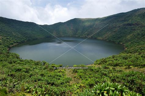 Photos and pictures of: Bisoke crater lake on Mount Bisoke, Volcanoes National Park, Rwanda ...