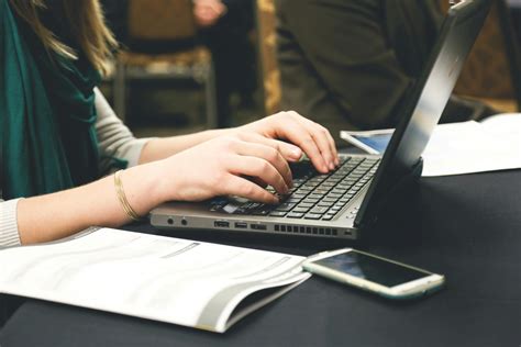 Woman Typing on Laptop · Free Stock Photo