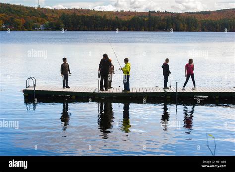 Children fishing on the dock at Bryant Pond in Maine Stock Photo - Alamy