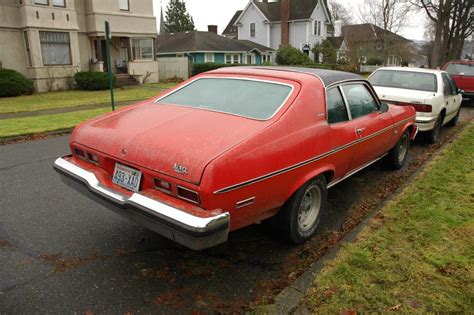 OLD PARKED CARS.: 1974 Chevrolet Nova Custom Hatchback.