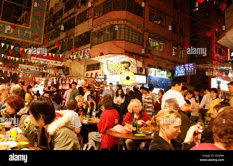 Chinese people eating at an outdoor restaurant in Hong Kong Stock Photo: 3652501 - Alamy