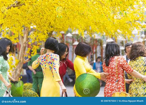 Vietnamese Lunar New Year. Women Wear Vietnam Tradition Ao Dai To Take ...