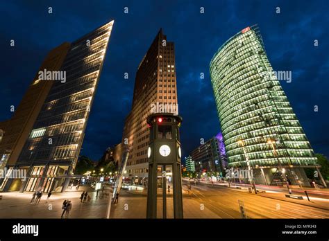 Berlin. Germany. Potsdamer Platz, night view of skyscrapers and the replica historical traffic ...