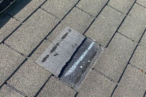 How do I know if I have wind damaged shingles?