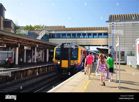 Train approaching platform, Feltham Railway Station, Feltham, Borough ...