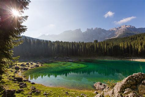 Lago di Carezza in morning light | Natural landmarks, Landmarks, Clouds