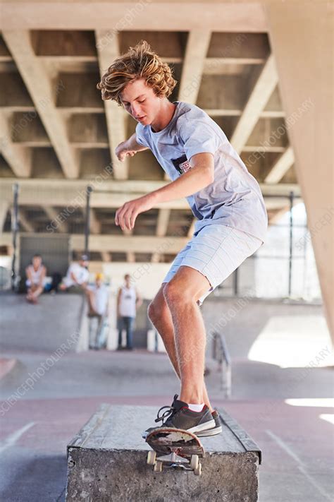 Teenage boy skateboarding at skate park - Stock Image - F016/5425 - Science Photo Library